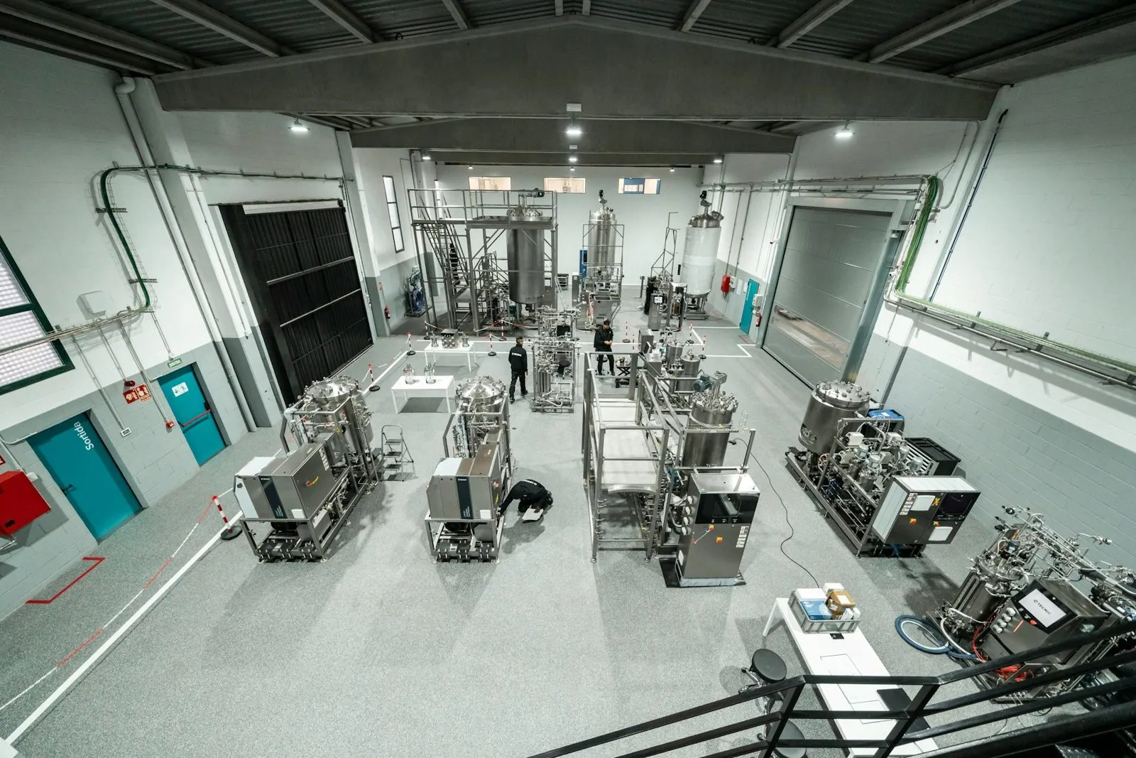 Stainless bioreactor tanks and skids on a pharmaceutical process floor